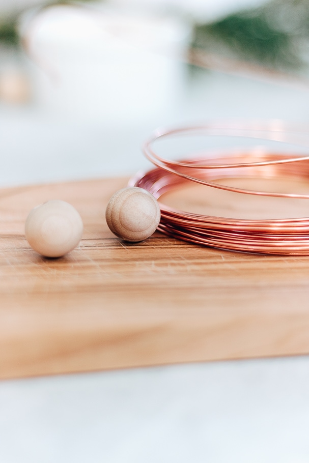 up close image of wood beads and copper wire