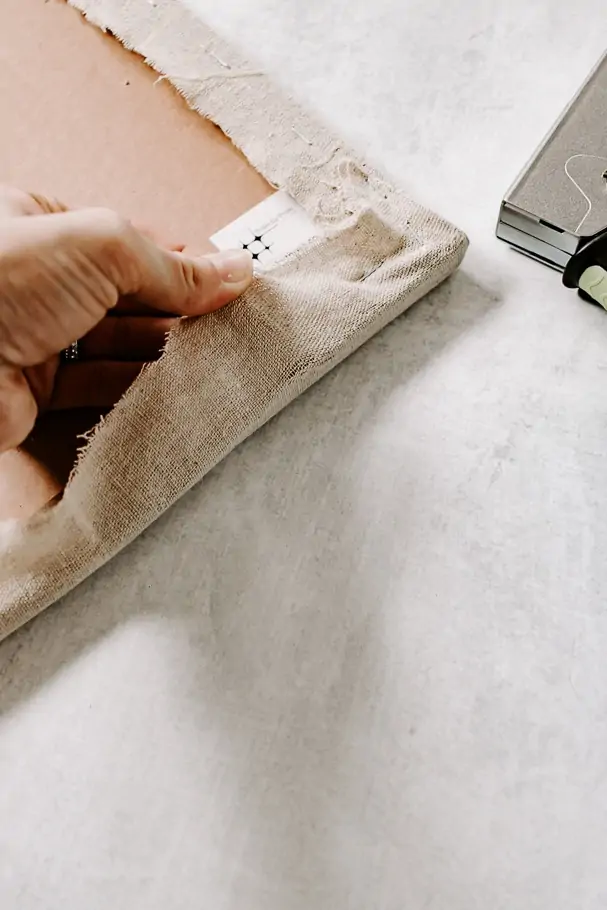 How to Make a Fabric Pinboard - Decor Hint pull fabric taut