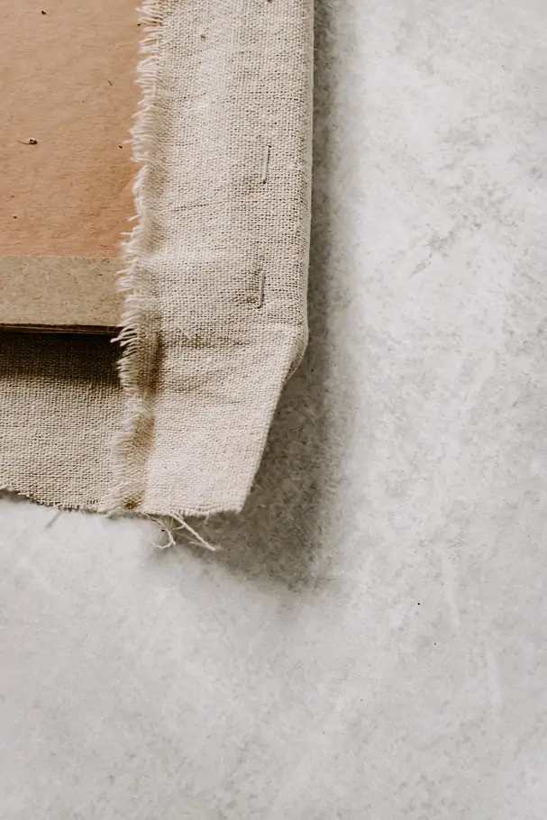 How to Make a Fabric Pinboard - Decor Hint staple corners