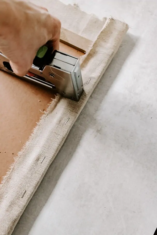How to Make a Fabric Pinboard - Decor Hint staple linen fabric to pinboard
