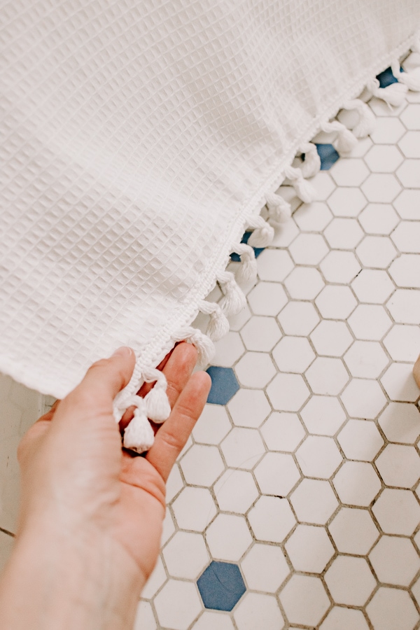 Add tassel trim to your shower curtain