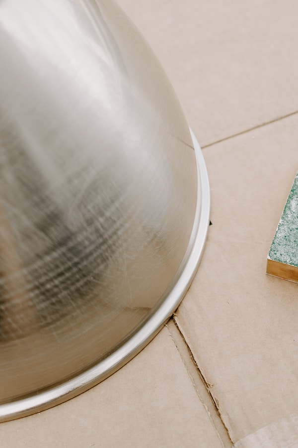 a light fixture with sanded scratches in it