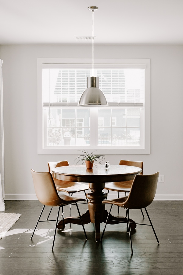 breakfast nook with round table and leather chairs