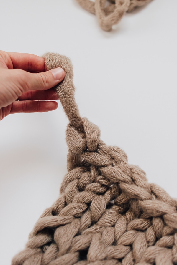 tie a knot at the end of your chunky knit blanket