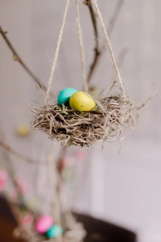 Make this Charming DIY Easter Tree with M&M's - Decor Hint DIY Easter Tree with little handmade bird nests - with M&M candies as the eggs.