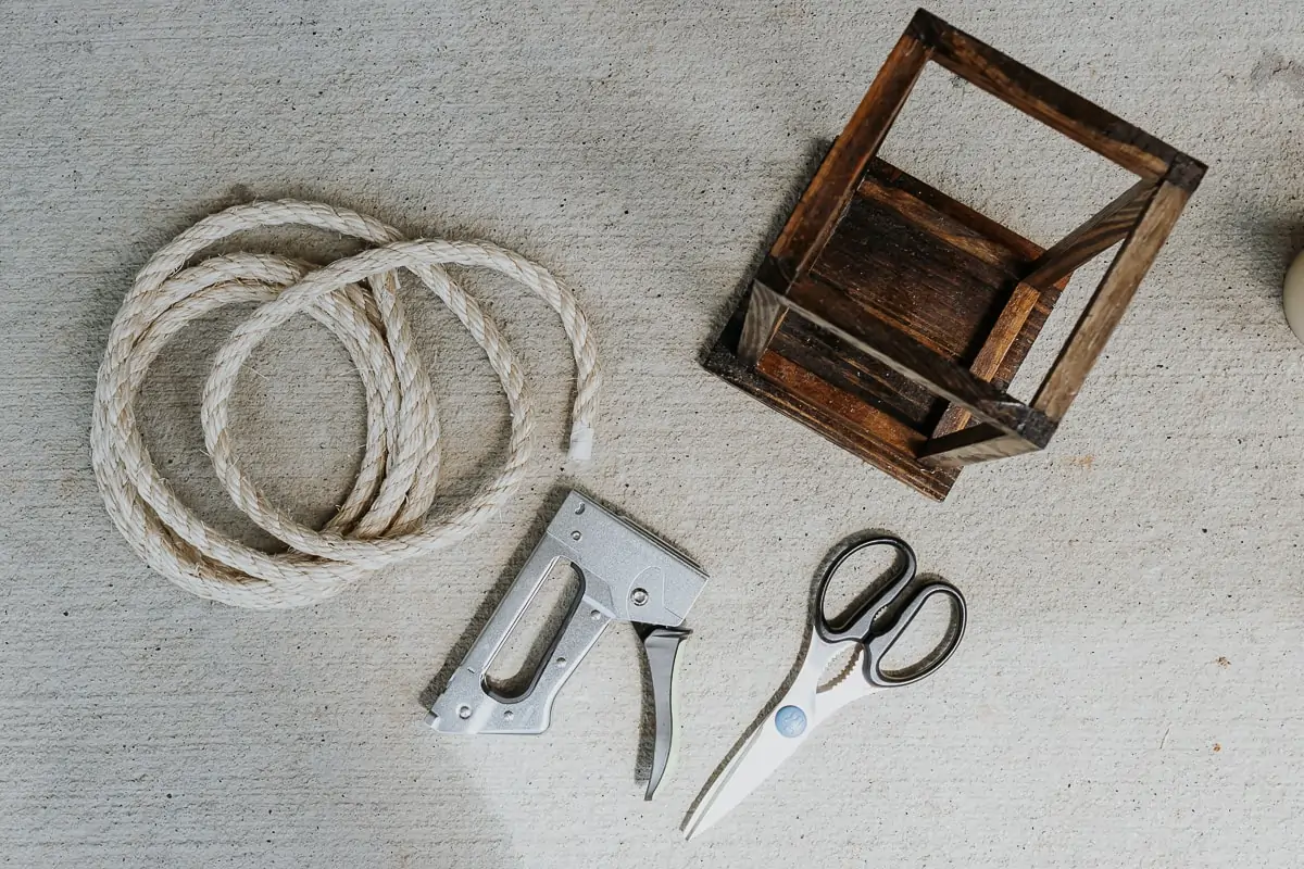 Pretty DIY Wood Lanterns - Decor Hint attaching a rope handle to wood lanterns