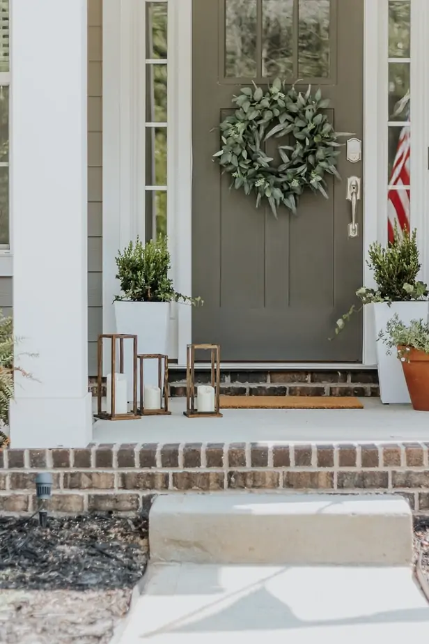 Pretty DIY Wood Lanterns - Decor Hint a set of three DIy Wood Lanterns on a front porch