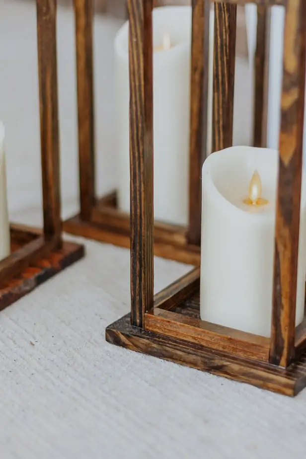 Pretty DIY Wood Lanterns - Decor Hint a set of three DIy Wood Lanterns on a front porch
