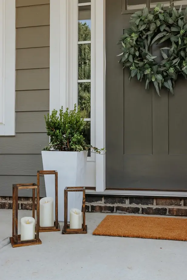 Pretty DIY Wood Lanterns - Decor Hint a set of three DIy Wood Lanterns on a front porch
