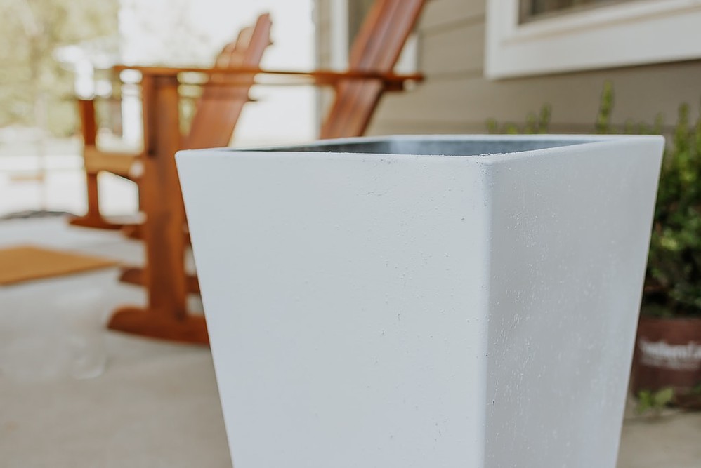 white plastic planter pot on front porch - how to paint outdoor planters - full tutorial in post