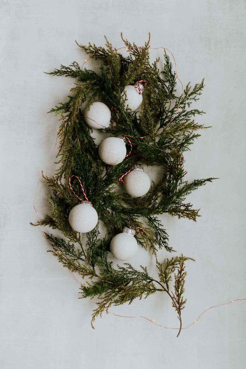 Easy Spray Painted Ornaments - DecorHint Spray Painted Ornaments - an easy tutorial for turning clear ornaments into stone effect aged ornaments!