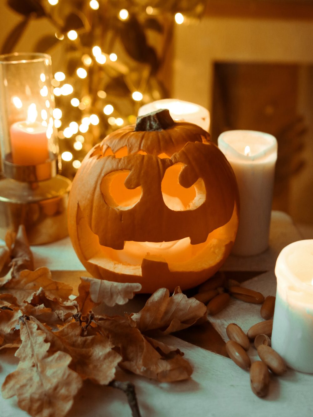 All the Fall Feels - Decor Hint lighted pumpkin with candles surrounding