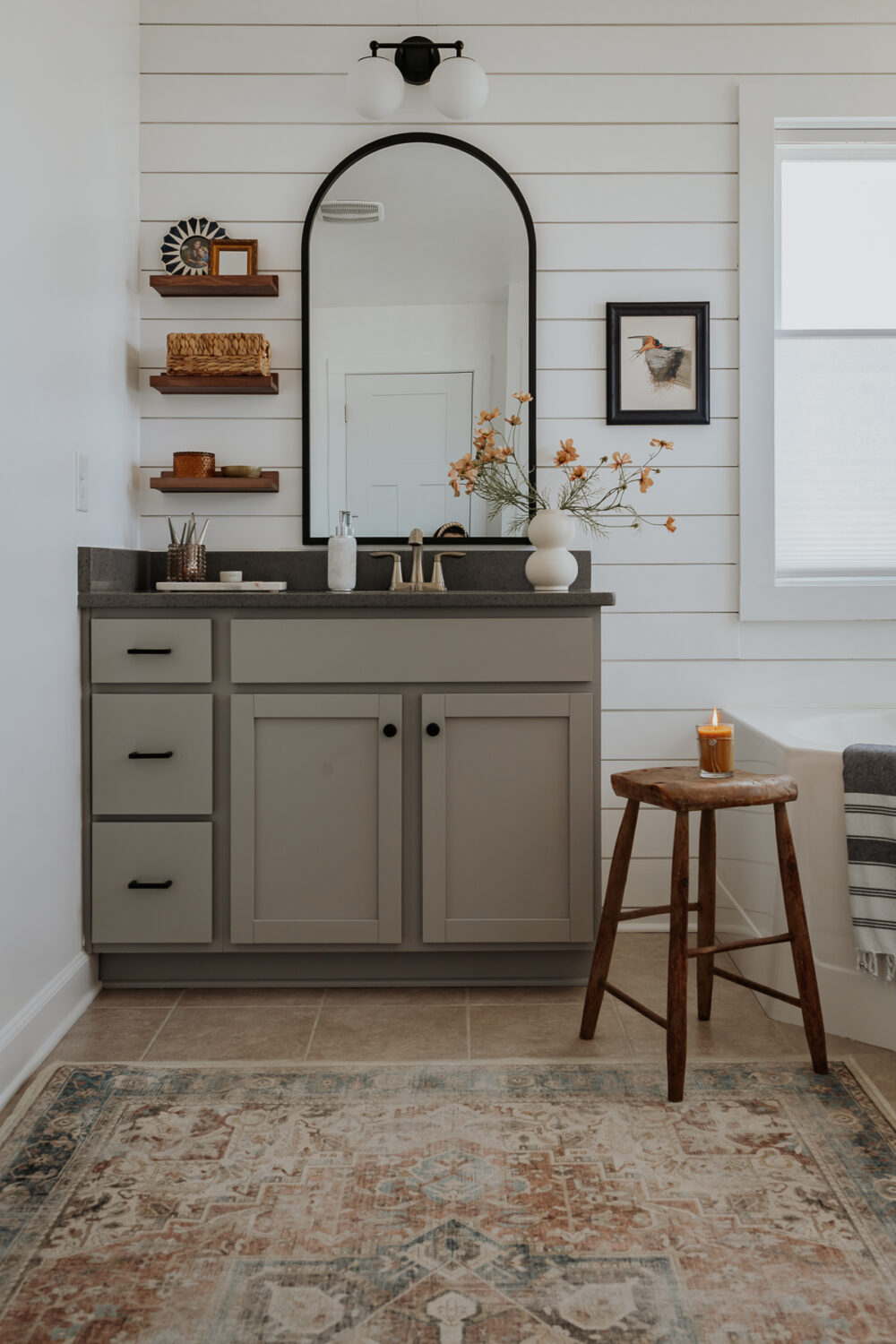 Shiplap Bathroom with gray cabinets and ruggable rug