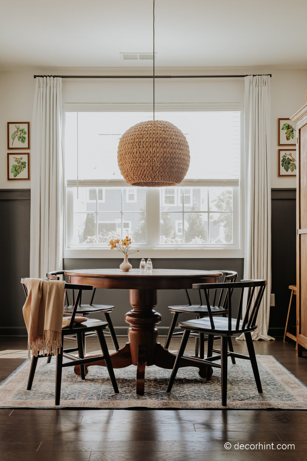 Breathe Life into Your Breakfast Nook with These Easy Ideas - Decor Hint breakfast nook with chair rail, white drapes and a rattan chandelier