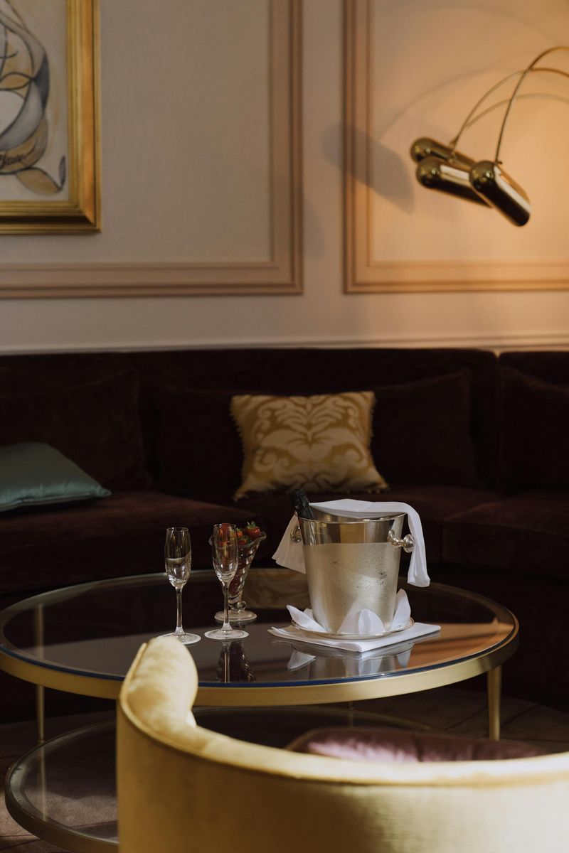 7 '90s Furniture Looks That Might Not Make A Comeback - Decor Hint Glass-top coffee tables with brass frames