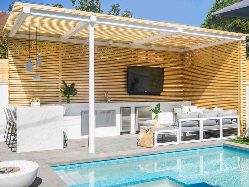 22 Florida Home Design Trends That Are Mega-Popular For Weird Reasons - Decor Hint Outdoor TVs Facing Swimming Pools