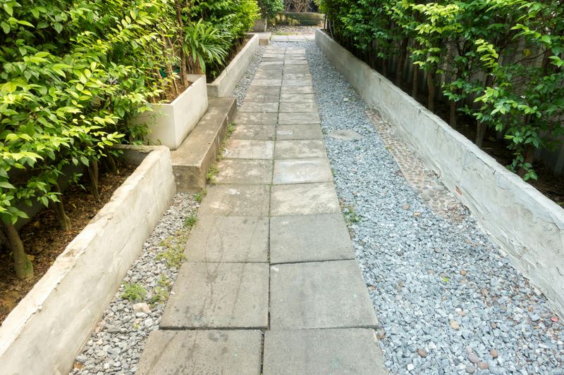 10 Quick Backyard Updates That Could Transform Its Look - Decor Hint Adding Mulch or Decorative Stones to Garden Beds