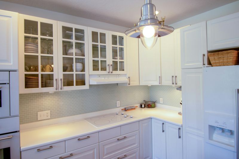 7 Smart Cabinet Tips That Could Open Up Your Kitchen Space - Decor Hint Use Glass-Front Doors on Upper Cabinets