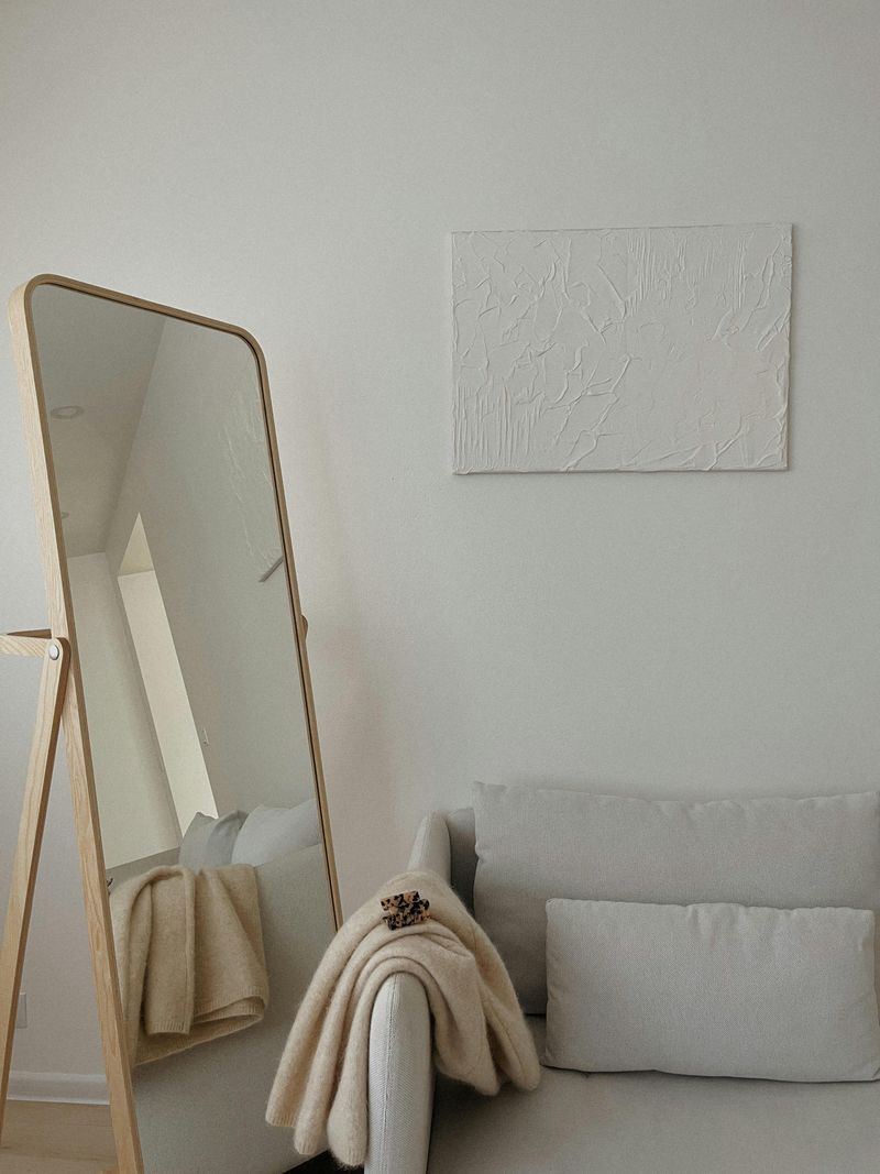 13 Ways Designers Place Furniture To Keep Rooms Light And Inviting - Decor Hint Mirrored Pieces to Reflect Light