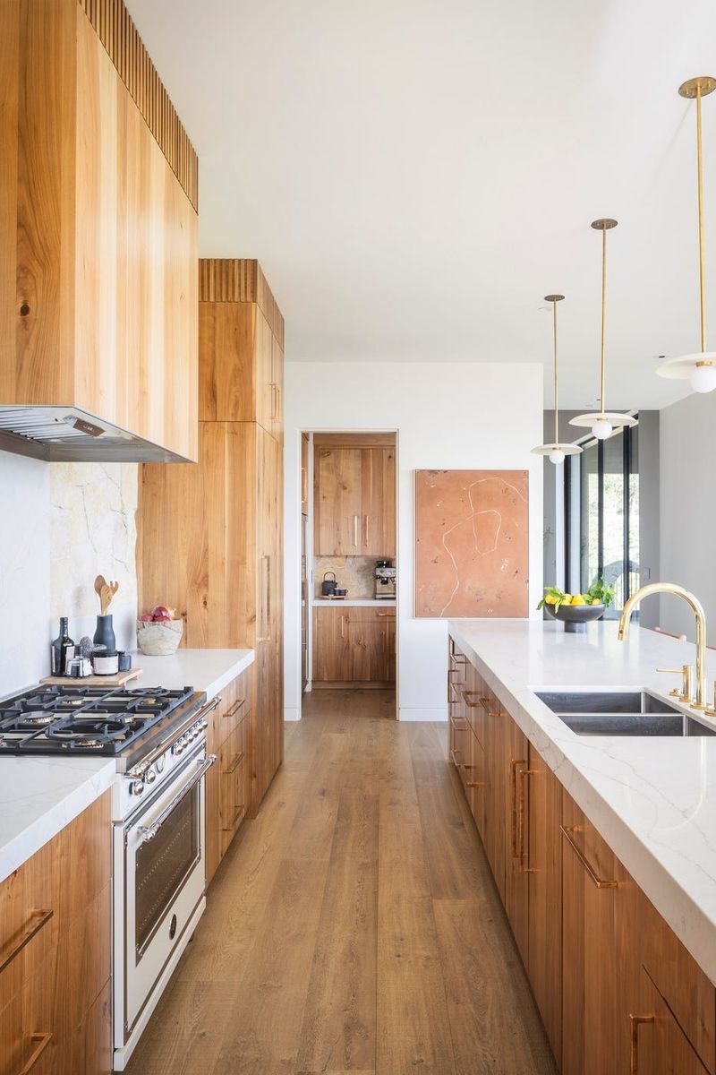 9 Ways To Make A Galley Kitchen Look Bigger And Brighter - Decor Hint Create Visual Flow with Flooring