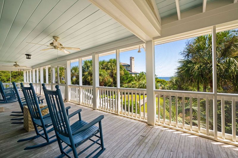 17 Charming Screened Rooms In South Carolina That Feel Like Childhood Summers - Decor Hint Georgetown River Rocker