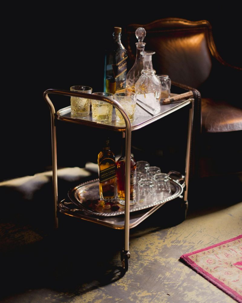 7 '90s Furniture Looks That Might Not Make A Comeback - Decor Hint Chrome and glass bar carts