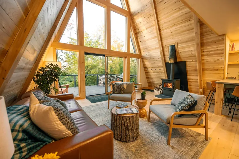 12 Gorgeous A-Frame Cabins For The Ultimate Cozy Escape - Decor Hint Off-Grid Adventure Cabin