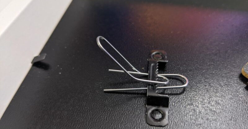 Stop Making Holes In Your Wall And Use A Paperclip Trick To Hang Decor