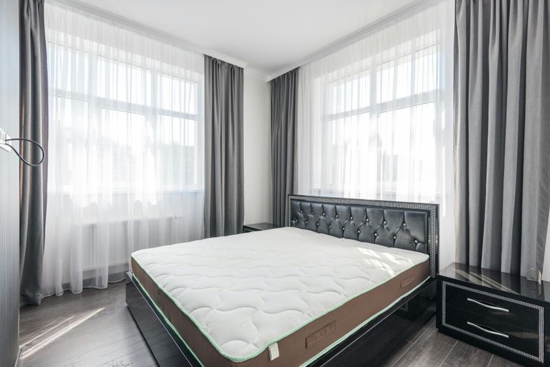 8 Visual Tricks That Open Up A Small Bedroom - Decor Hint Hang Curtains High And Wide