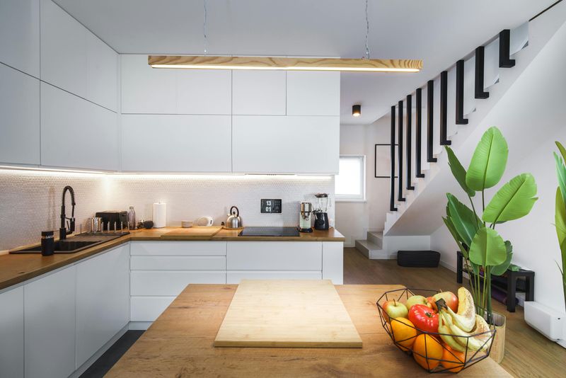 13 Small Tweaks That Instantly Make A Rental Kitchen Cozier - Decor Hint Incorporate a decorative pendant light