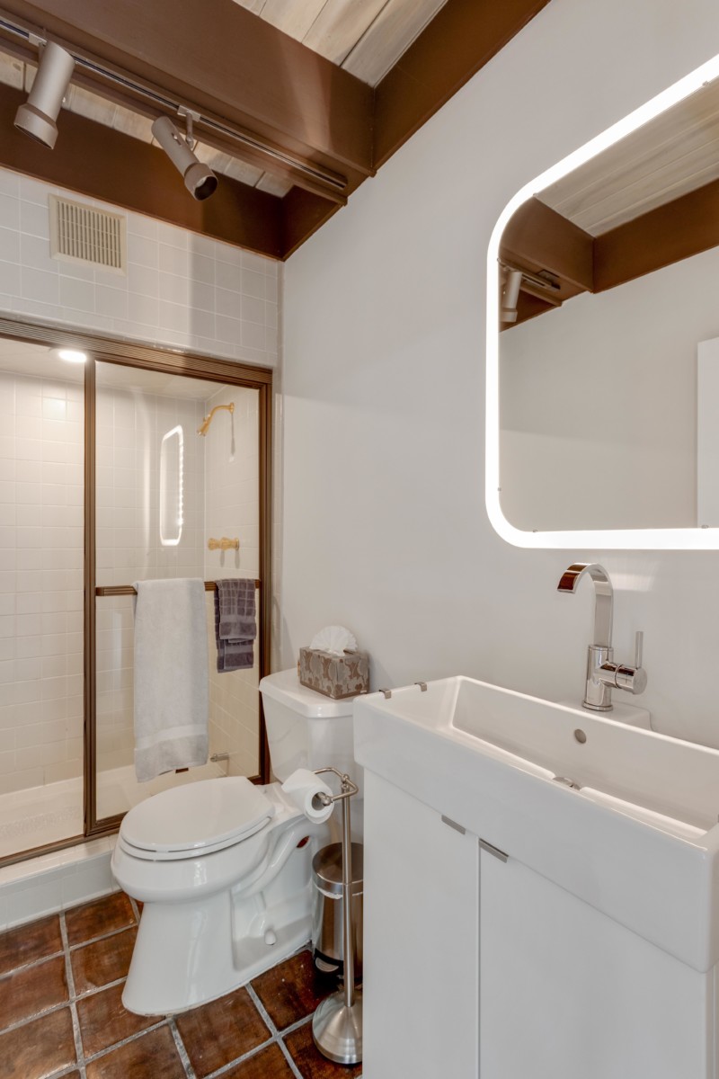 Tour This Iconic Mid-Century Marvel Hidden In The Hills Of Buckhead - Decor Hint primary bathroom