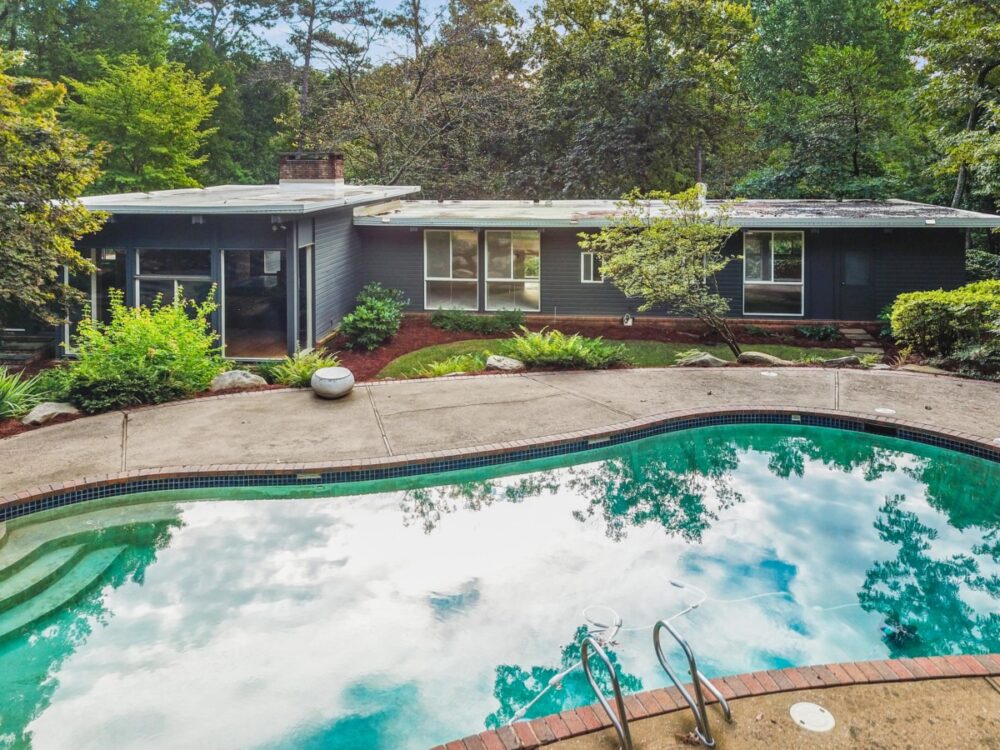 Tour This Iconic Mid-Century Marvel Hidden In The Hills Of Buckhead - Decor Hint relaxing poolside