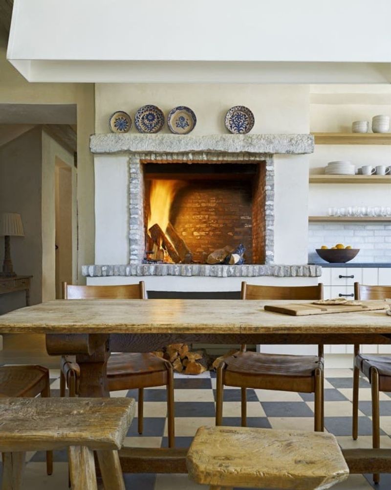 Large Family-Style Kitchen With Central Stone Fireplace