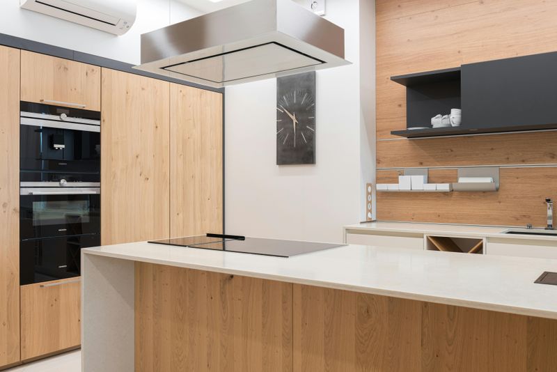 9 Kitchen Tweaks That Could Bring Midcentury Modern Vibes - Decor Hint Sleek Flat-Front Cabinets