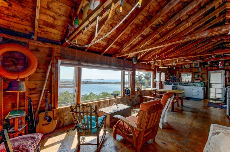 7 Maine Coastal Cottages Styled In Oxblood And Deep Purple Accents - Decor Hint A Rustic Cabin Featuring Oxblood-Stained Wood Beams