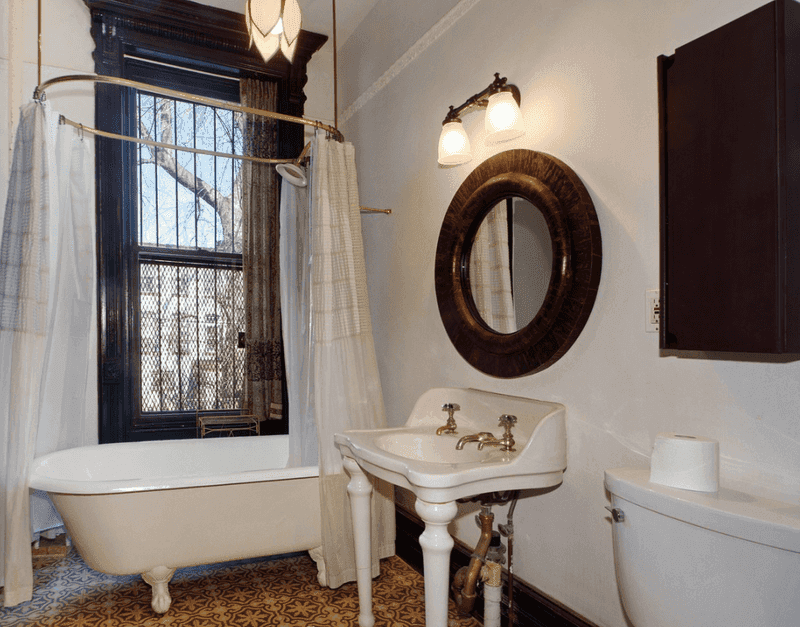 Incorporate Pedestal Sinks And Black-And-White Tile Floors