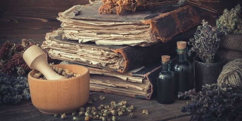 Stacked Books With Witchy Props