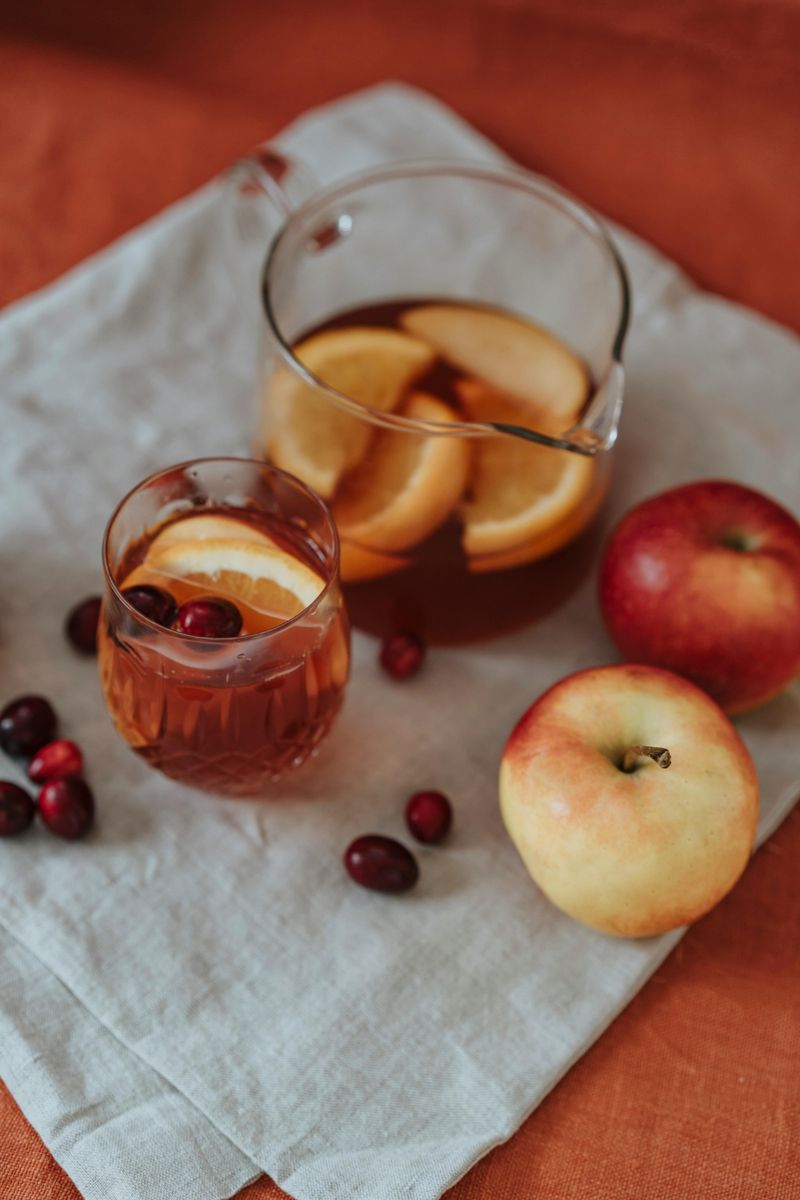 Cider Station Setup With Mugs, Apple Decor, And Warm Spices