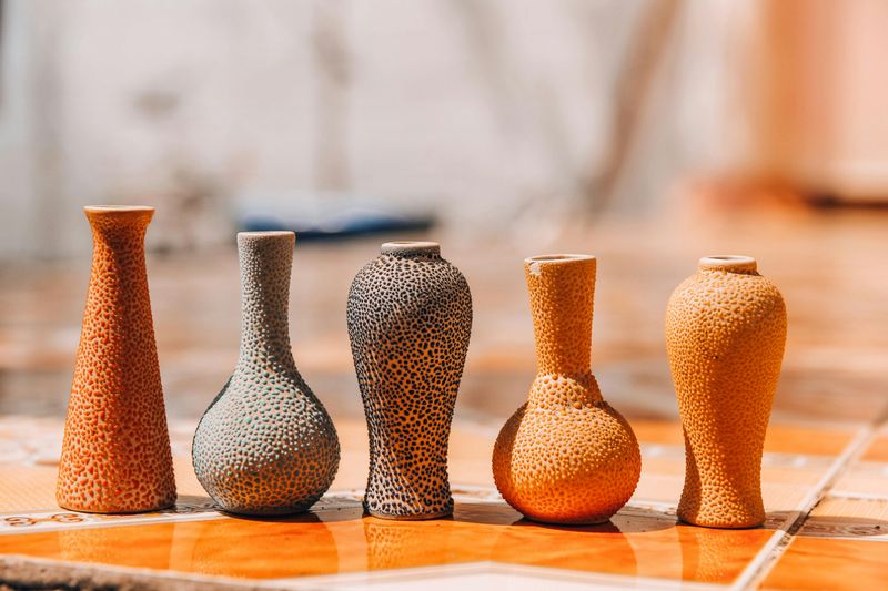 Timeless Earth-Toned Decor Ideas That Suit October Perfectly - Decor Hint Burnt Orange Vases