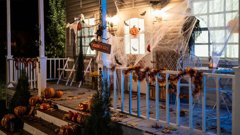 White Spider Web Garlands On Dark Railings