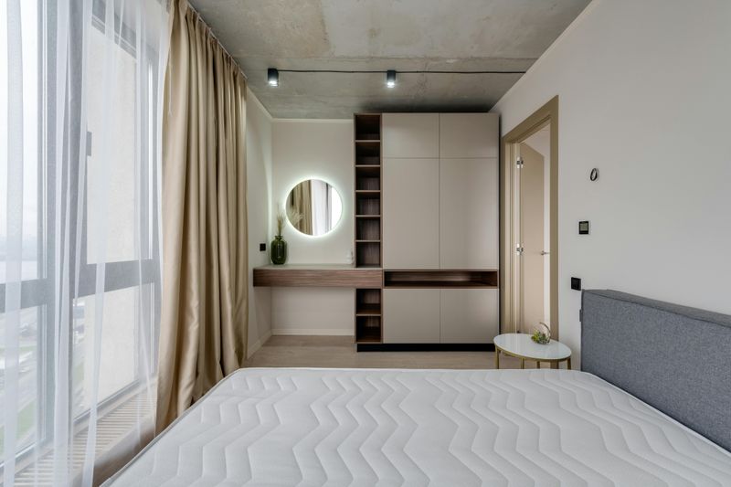 9 Ways You Might Make A Tiny Bedroom Appear Larger According To A Designer - Decor Hint Keep floors clutter-free