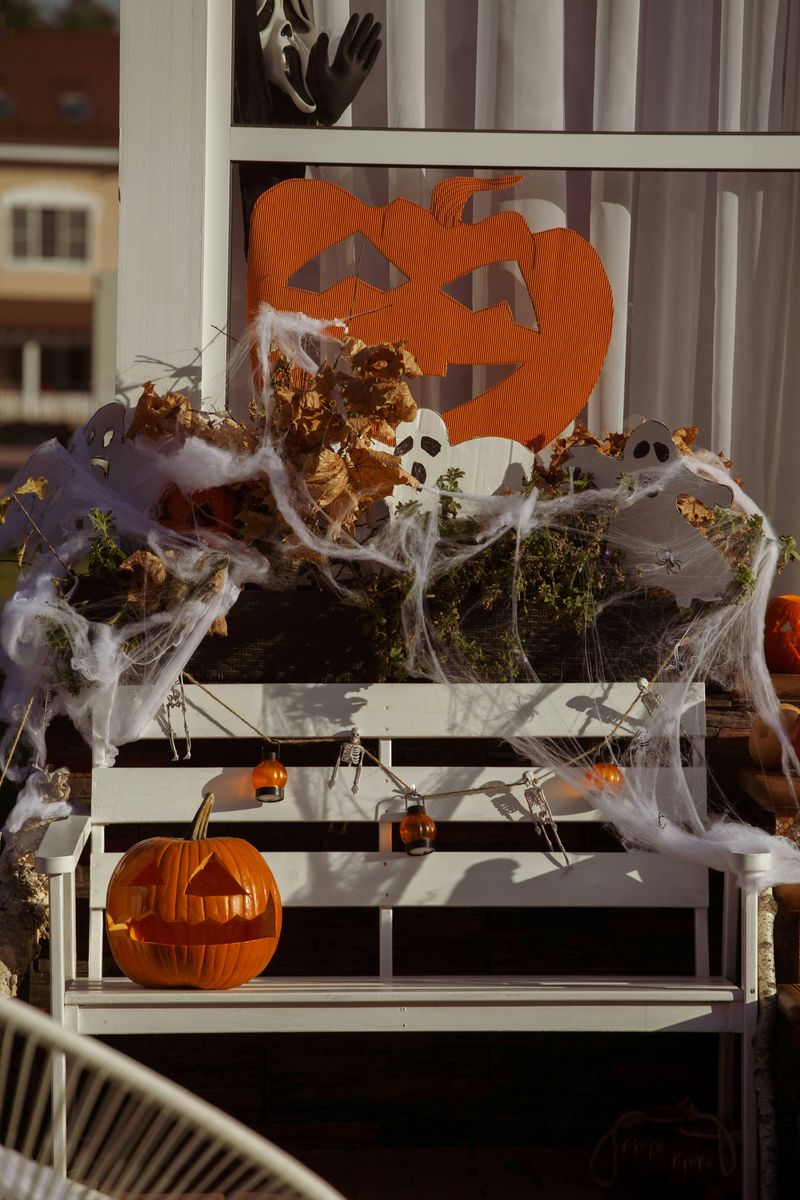 5 Porch Rocking Chair Setups That Capture Fall Afternoons - Decor Hint Painted Rocking Chairs with Pumpkin Accents