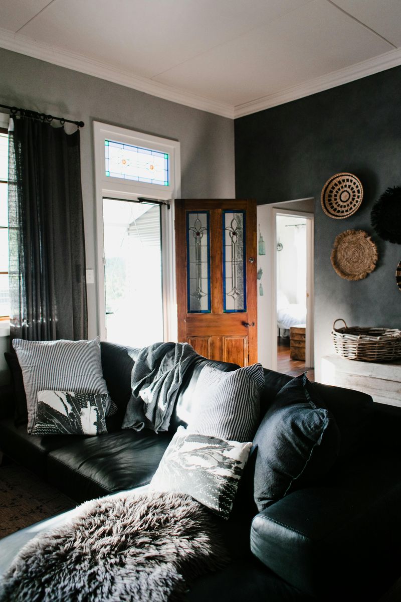 Common Living Room Decor Choices That Can Make Your Space Feel Stuffy - Decor Hint Hulking Dark Furniture That Swallows Space
