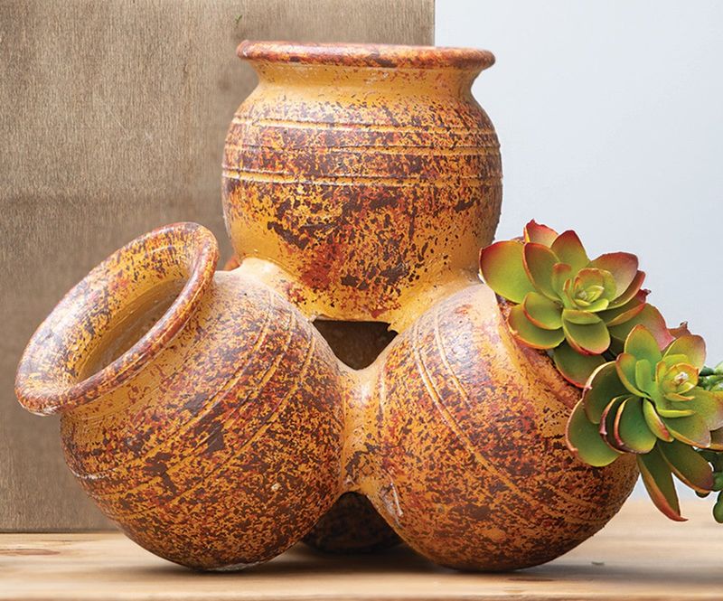 Clustered Terracotta Pots By The Fireplace