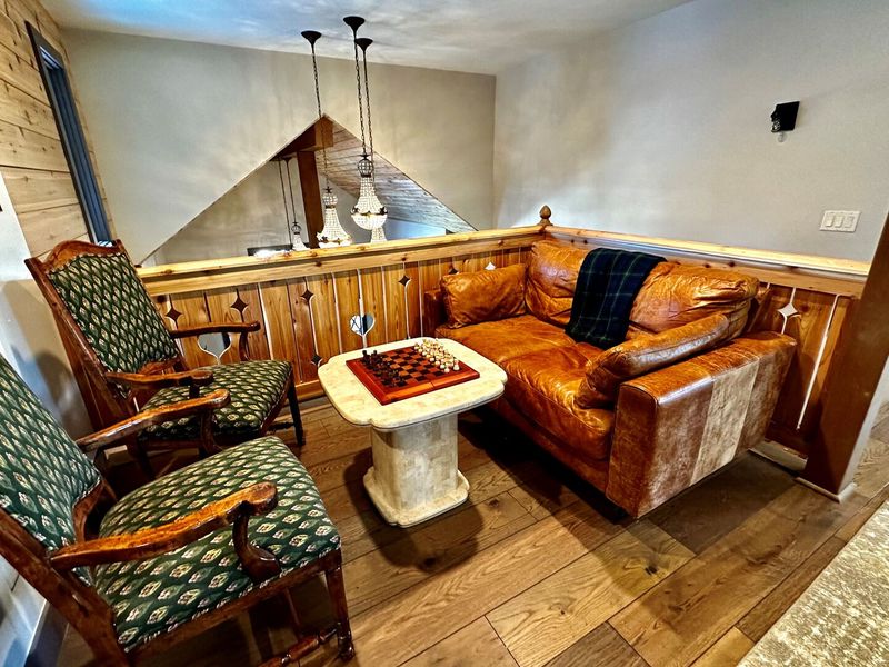 Vintage Leather Armchairs And Soft Throws
