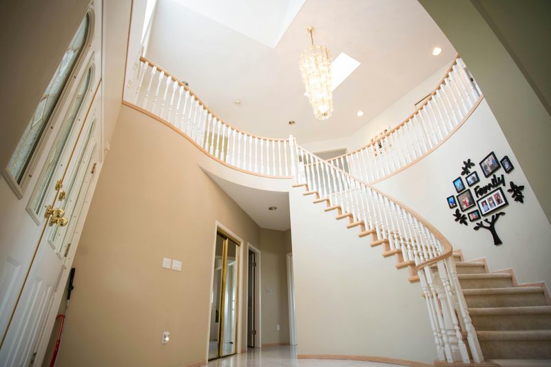8 Rooms That Could Feel Outdated In Modern Homes - Decor Hint Foyer with Oversized Chandelier
