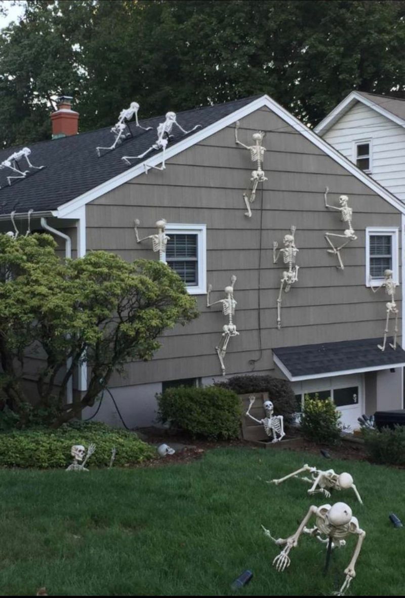Skeletons Climbing The House Or Fence