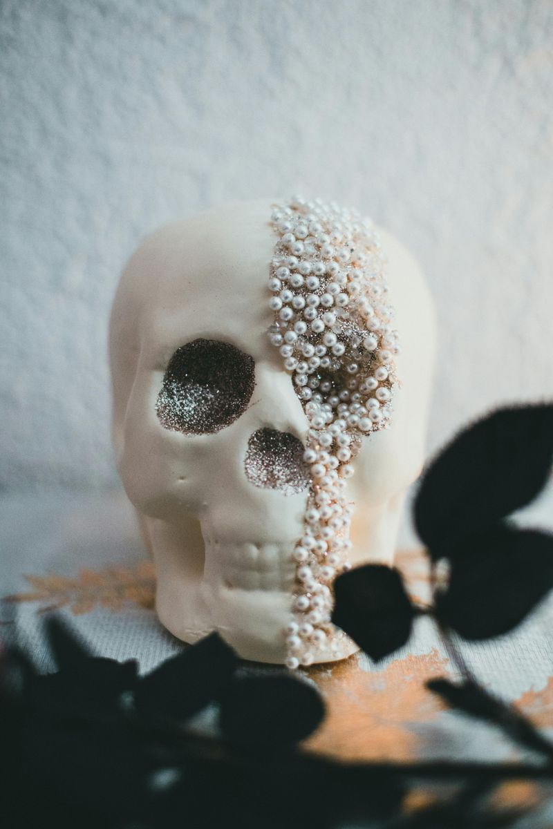 7 DIY Halloween Decorations That Look Expensive But Aren't - Decor Hint Painted Terracotta Skull Planters