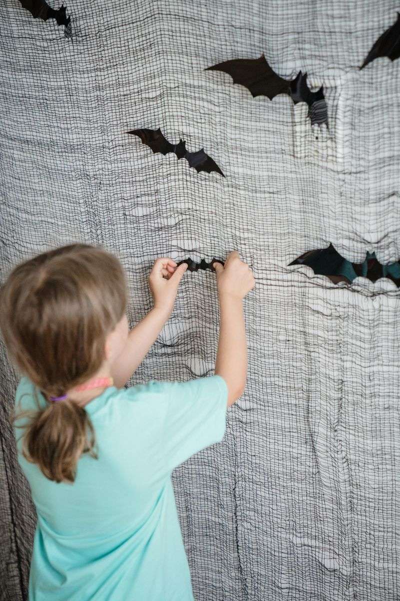 7 DIY Halloween Decorations That Look Expensive But Aren't - Decor Hint Fabric Bats Hanging From the Ceiling