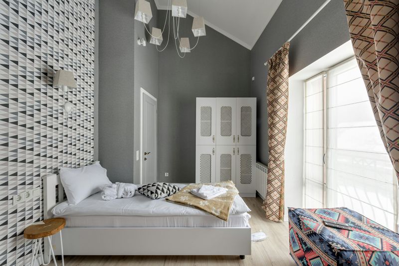 9 Ways You Might Make A Tiny Bedroom Appear Larger According To A Designer - Decor Hint Use subtle patterns instead of bold prints